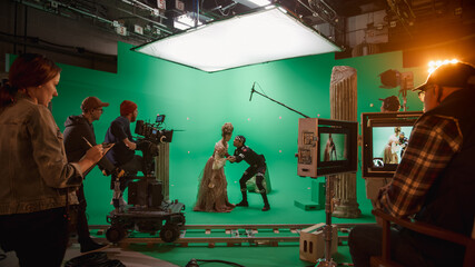 On Big Film Studio Professional Crew Shooting History Costume Drama Movie. On Set: Directing Green Screen Scene with Beautiful Lady Wearing Renaissance Costume Meets Actor Playing Monster - obrazy, fototapety, plakaty