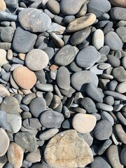 Sea pebbles background, natural colors