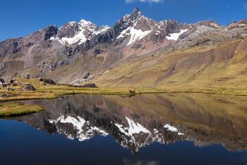 Naklejka na ściany i meble Ausangate Andes mountains in Peru and lake