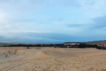 View of White Sand Dunes with the blue sky in dawn, Mui Ne, Vietnam