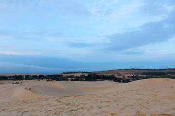 View of White Sand Dunes with the blue sky in dawn, Mui Ne, Vietnam