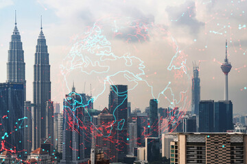 World planet Earth map hologram over panorama city view of Kuala Lumpur, Malaysia, Asia. The concept of international connections and business. Multi Exposure.