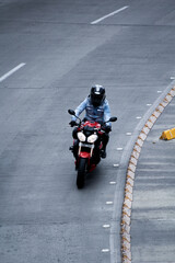 Motorcycle rider in a empty road, Bogota, Colombia