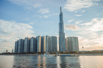 Beautiful blue sky view at Landmark 81 is a super tall skyscraper in center Ho Chi Minh City, Vietnam and Saigon bridge with development buildings, energy power infrastructure.