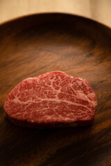 Beef fillet steak on the wooden plate