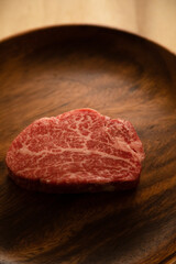 Beef fillet steak on the wooden plate