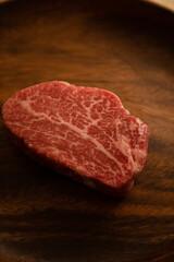 Beef fillet steak on the wooden plate