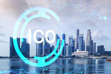 ICO icon hologram over panorama city view of Singapore, the hub of blockchain projects in Asia. The...