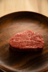 Beef fillet steak on the wooden plate