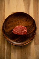 Beef fillet steak on the wooden plate