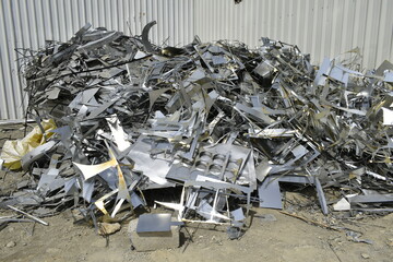 sheet metal wastages at the outside of Duct factory. Industrial Aluminum wastages