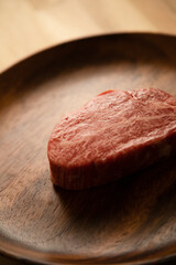 Beef fillet steak on the wooden plate