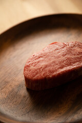 Beef fillet steak on the wooden plate