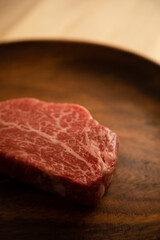 Beef fillet steak on the wooden plate