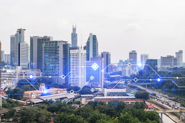 Technology hologram over panorama city view of Kuala Lumpur. KL is the largest tech hub in...