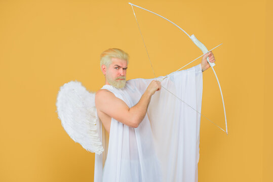 Arrow of love. Cupid throws arrow with bow. Bearded angel with bow and arrow. Cupid angel with bow and arrows. Cupid in valentine day. Valentines Day concept. Valentines cupid.