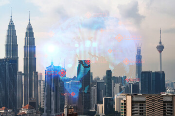 World planet Earth map hologram over panorama city view of Kuala Lumpur, Malaysia, Asia. The concept of international connections and business. Multi Exposure.