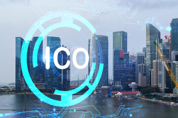 ICO icon hologram over panorama city view of Singapore, the hub of blockchain projects in Asia. The...