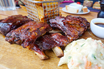 Grilled steak - Grilled meat ribs on the plate with hot sauce