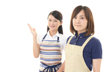 エプロンを着た二人の女性