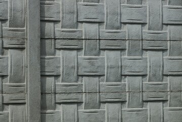gray stone texture of patterned concrete wall fence
