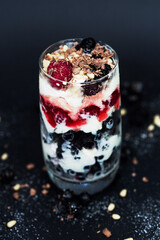 Currant, ice cream, raspberry and pine nuts in dessert