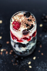 Raspberry, currant, ice cream, chocolate and pine nuts in dessert