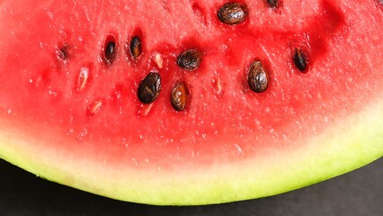 Red delicious watermelon with bones close-up. Macro photo 