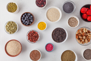 Healthy food clean eating selection: berry, seeds, nuts, superfood, cereals. Health and super food to boost immune system high in antioxidants, anthocyanins, minerals and vitamins.