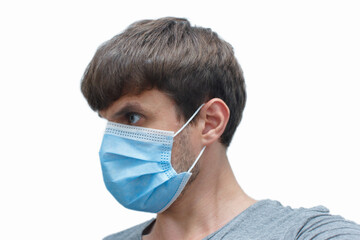 the man in the mask-protection from the coronavirus. a man wears a protective face mask at home. Stop the virus and epidemic diseases.