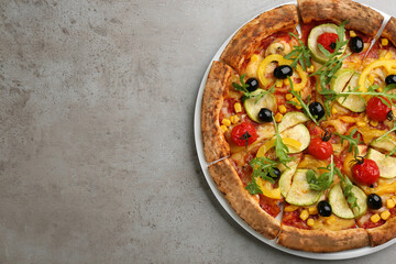 Delicious vegetable pizza on grey table, top view. Space for text