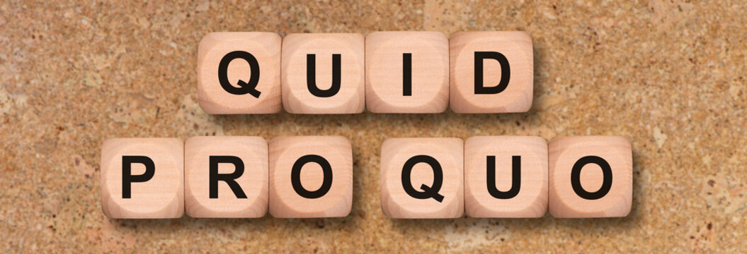 quid pro quo printed on wooden cubes