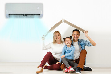 air conditioning in living room with happy family moving to new apartment