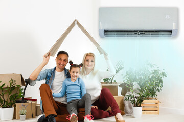 Happy Family Under Air Conditioning At Home