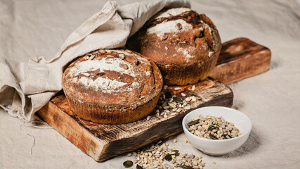 Homemade rye sourdough bread with sunflower seeds, nuts and caraway seeds. Homemade baking.