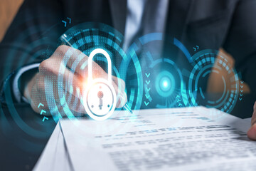 Businessman in suit signs contract. Double exposure with lock icon hologram. Man signing agreement...
