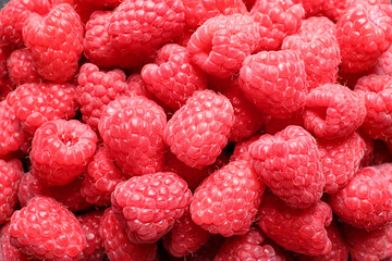 Fresh sweet ripe raspberries as background, closeup