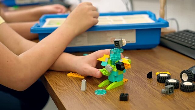 Incognito kid using building kit.