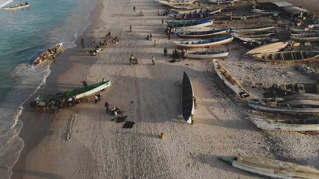 Panoramic view of the beach in Mauritania. Beach in Mauritania. Beach. View. 4k. 4k view.Fishermen. They're fishing. Sea. Ocean. Craft. Bird's eye view. Mauritania in 4k. panorama in 4k. Mauritania.
