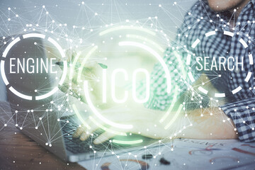 Blockchain theme hologram with man working on computer on background. Concept of crypto chain....