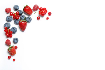 Mix of fresh berries on white background, flat lay