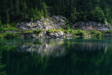 Lake in the mountains reflecting stones