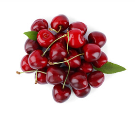 Tasty ripe red cherries with green leaves isolated on white, top view