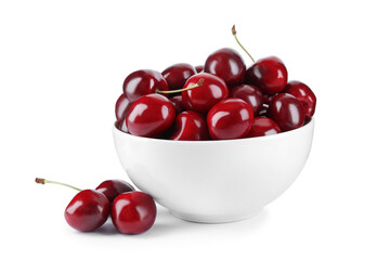 Tasty ripe red cherries and bowl isolated on white