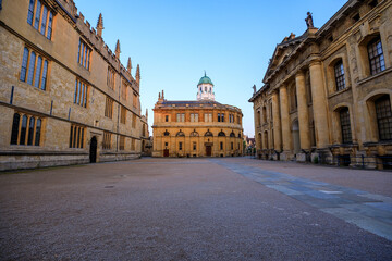 The side of the Sheldonian Theatre and the Clarendon Building with no people around, early in the morning. Oxford, England, UK.
