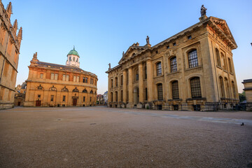 The side of the Sheldonian Theatre and the Clarendon Building with no people around, early in the morning. Oxford, England, UK.
