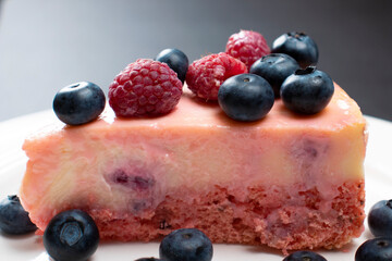 Cheesecake with berries close-up. Concept food photography. Sweets and berries. Copy space. Beautiful background.