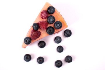 Cheesecake with berries isolated on a white background top view. Flat lay food photography.