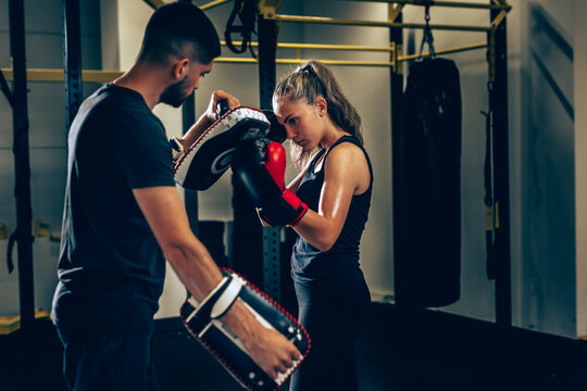 Woman Training Kick Box With His Personal Trainer