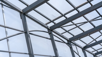 steel building framework with glazing structure on construction site of city street